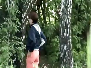 Woman looking for place to pee outdoors