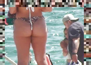 Shameless babe in tiny bikini voyeur clip