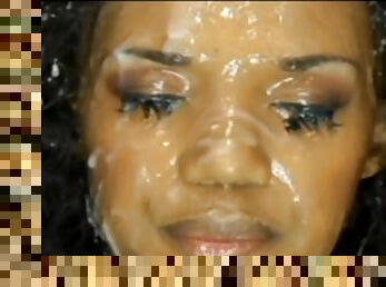 Ebony cutie gets face covered in sperm - bukkake orgy
