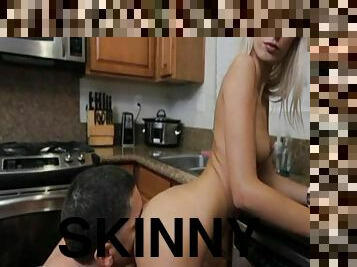 Skinny blonde Erica fucks in the kitchen