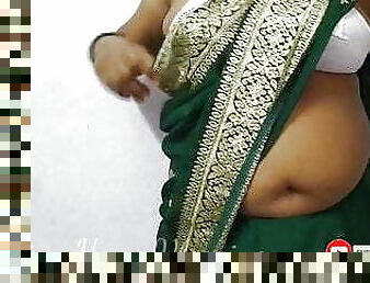 Aunty in a Sexy Saree wearing a bra