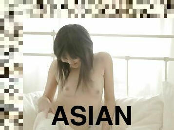 Sexy Asian student Fen fingers her creamy twat in bed!