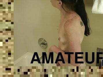 Solo teen has fun in the bathtub