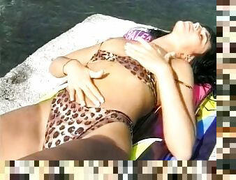Dark haired German beauty loves to fuck on the beach