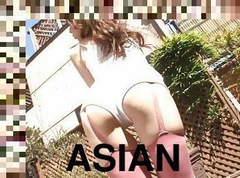 Sexy asian shows off shaved pussy