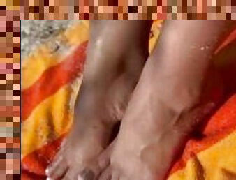 Latina gets sand on her sexy feet