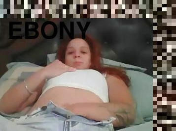 Ebony masturbates on bed