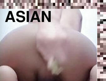 Asian boy feeds his hungry hole with an eggplant and shows the gap