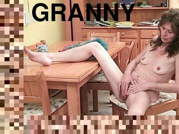 Granny with saggy tits and hairy pussy masturbates