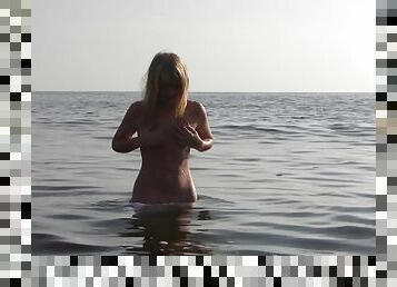 Divine Blonde Teen Blissfully Naked in the Sea