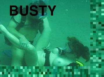 Busty girl having underwater sex with her man