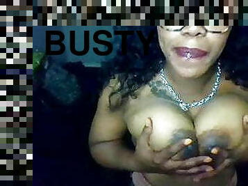 Busty Ebony drools on her big brown boobs