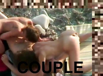 Couples fuck right on the beach