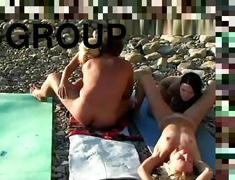 Hot swingers foursome at the nude beach