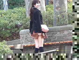 Asian teen pulls up skirt