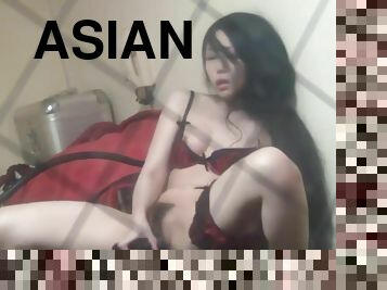 Asian plays with dildo
