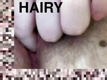 Bushy virgin plays with pussy