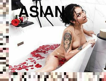 Tattooed Asian girl with natural tits gets fucked in the bathroom