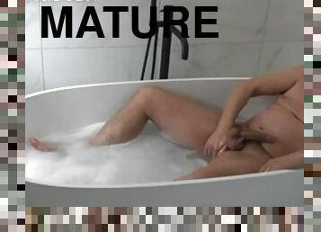 Chubby daddy lies back in the bath producing stinking farts from his fat ass PREVIEW