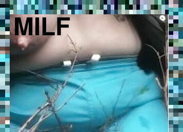 Milkymama in forest milking engorged tits rolling joint