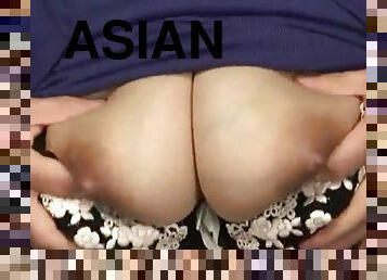 Voluptuous asian milf getting her big tits fondled close up