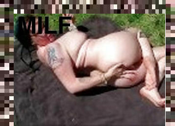 Sexy American milf , sun bathing in yard for the neighbors to see.