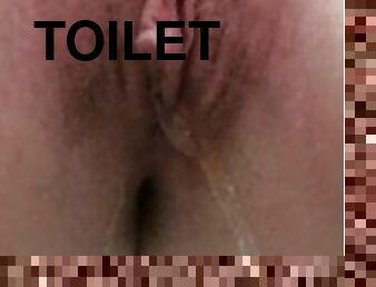 Closeup pee on the toilet