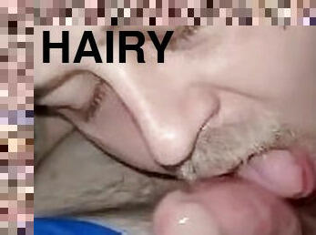 Sucking hairy cock on couch