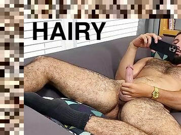 Hairy hunk masturbates with big cock and shows feet solo