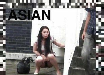 embarrassed asian peeing