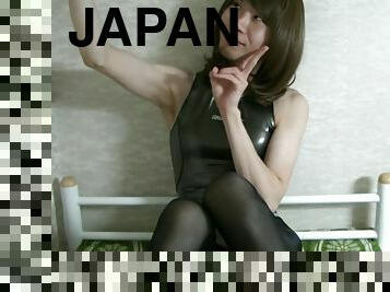 Japanese crossdresser in a rubber swimsuit