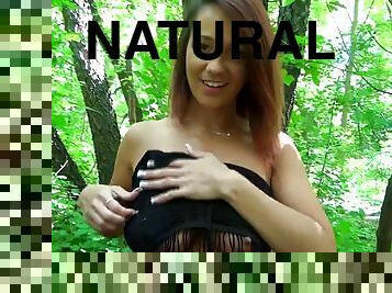 Young brunette Nikki Sims flashing natural boobies outdoors
