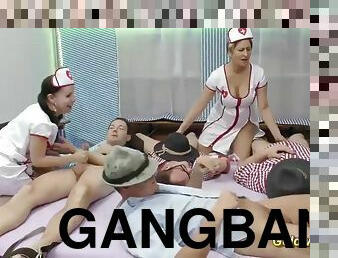 Stunning nurses help their patients in a wild gangbang scene