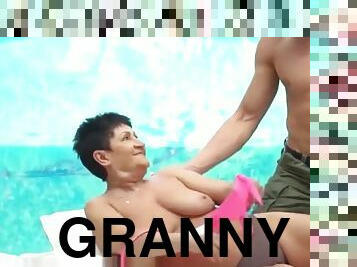Chubby granny blows young cock outdoors