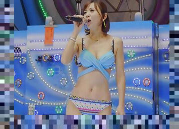 Slender asian teen sings us a song in bikini