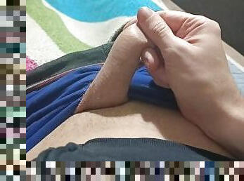 Guy in blue underpants plays with his dick, rubs his dick