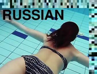 Russian redhead model with big tits Katrin Privsem swimming