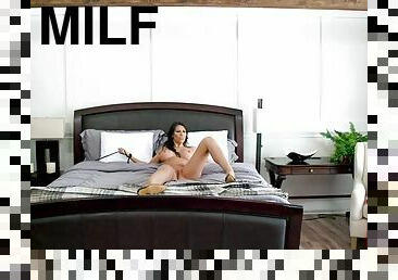 Warm hearted brunette spread her legs and fucks on the bed