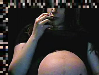 Pregnant slut is smoking in the room