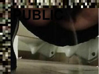 Pissing on the public bathroom floor