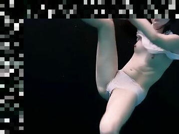 Pale and pretty andrejka shows her slim body underwater