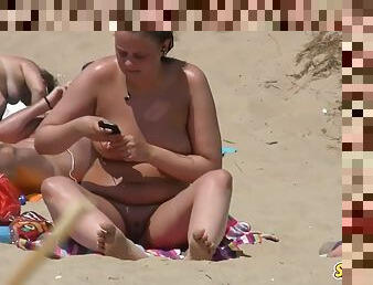 Big pussy lips close up voyeur video of amateur milf on the beach