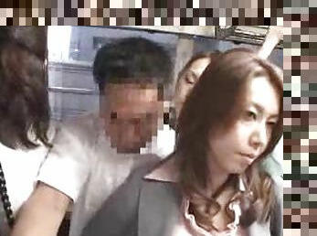 Asian babe strokes his cock on a public bus