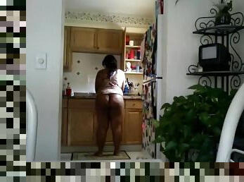 Black chick does the dishes in panties