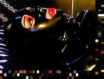 Chained lesbian in latex wants her master to punish her on the bed