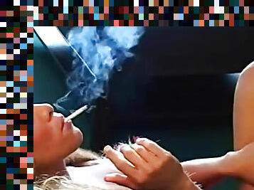 Busty hottie smokes sensually