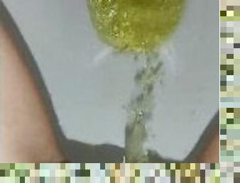 Huge golden shower in the toilet (closeup)