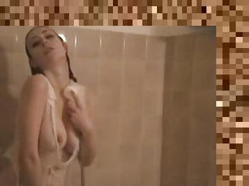 Sexy and sensual shower with a pretty busty young woman