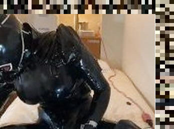 Full body latex female masker enjoys ejaculation through metal tube penis sack