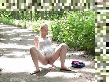 Cutie on a stroll in the woods takes a piss